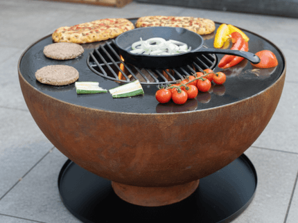 HEAT vuurkorf Gystad sfeerbeeld met eten
